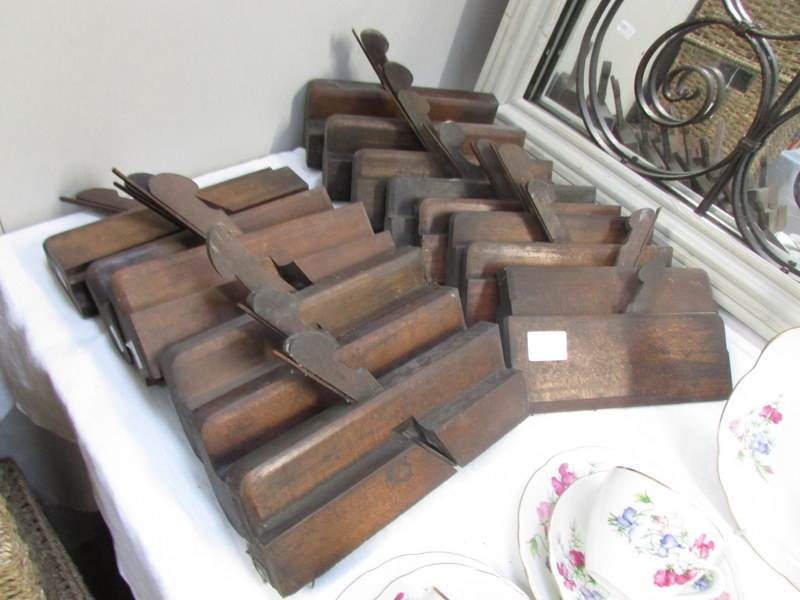 14 old woodworking planes.