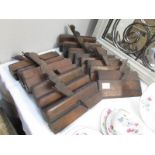 14 old woodworking planes.