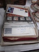 A quantity of UK stamps inlcuding 2 stock books, commemorative first day covers etc.