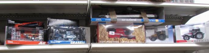 A quantity of boxed mixed makers die cast tractors and implements.