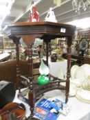 A mahogany table with gallery base.