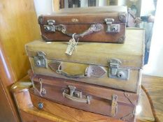 3 good old leather suitcases.