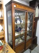 An Edwardian mahogany inlaid display cabinet.