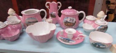 A collection of pink souvenir china.