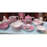 A collection of pink souvenir china.