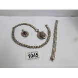 An unmarked white metal locket on heavy metal chain (possibly Scandinavian),