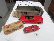 A boxed Schuco tin plate car and a Shuco FEX 1111 car.