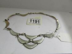 A Scandinavian white enamel 3 tiered necklace, circa 1970's in silve, stamped on back ' A Sch,