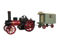 A scratch built model of a steam engine with showman's caravan (not live steam).