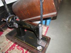 A cased Singer sewing machine,.