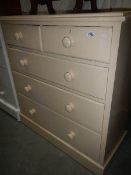 A 2 over 3 painted pine chest of drawers.