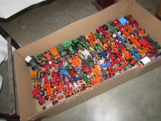A large quantity of unboxed die cast tractors.