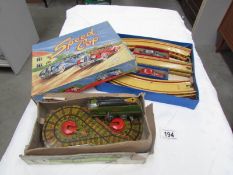 A boxed Marx tin plate speed cop racing set and a Mettoy Railways mechanical dreamline locomotive.