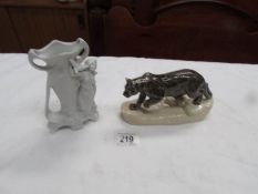 A figure of a mountain cat and a German bisque spill vase.