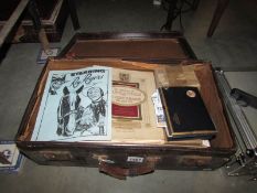 A suitcase full of miscellaneous ephemera including cigarette cards, county maps, Harmsworth prints,