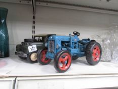 A large tin plate Fordson tractor and Land Rover.