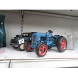 A large tin plate Fordson tractor and Land Rover.