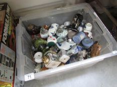 A mixed lot of assorted pottery and china lighters including Delft, Jasper ware etc.