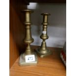 A pair of brass candlesticks.