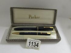 A cased Parker Duofold fountain pen and propelling pencil.