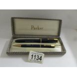 A cased Parker Duofold fountain pen and propelling pencil.