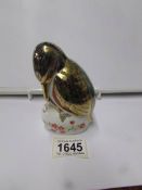 A Royal Crown Derby paperweight, bird with fish in beak.
