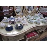 A 21 piece tea set and various cups and saucers.