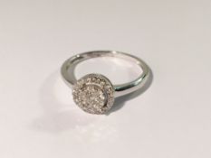 A 9ct white gold and diamond ring, size O.