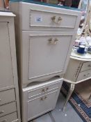 A pair of cream bedside cabinets,.