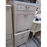 A pair of cream bedside cabinets,.