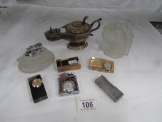 A collection of cigarette lighters including Windsor De Lux Time Lite, Dunhill Aladdin Lamp,