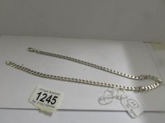 A silver kerb link chain (20"), 30.8 grams.