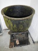 A heavy cast iron fire cauldron.