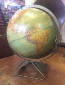 An American Globe having the earths high spots moulded in relief by Replogle of Chicago.