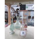 3 glass perfume bottles, a glass vase and a quantity of hat pins.