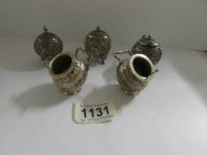 A 5 piece Indian silver cruet set with 3 English silver stamps.