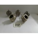 A 5 piece Indian silver cruet set with 3 English silver stamps.
