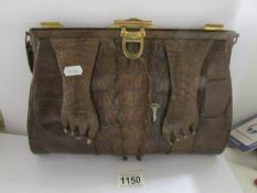 An old crocodile skin hand bag.