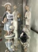 4 Lladro figures including schoolgirl with doll,