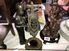 3 wooden figures of Asian and African origin and 2 wooden bases.