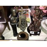 3 wooden figures of Asian and African origin and 2 wooden bases.