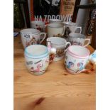 A quantity of Edward VIII, George V and Elizabeth II commemorative mugs.