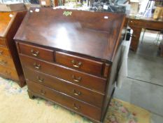 A mahogany bureau.