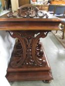 A Victorian walnut Canterbury.