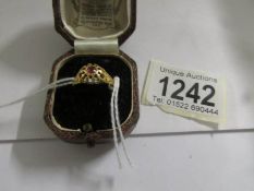 A ruby set ring in 18ct gold dated Birmingham 1913, size N.
