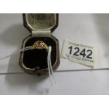 A ruby set ring in 18ct gold dated Birmingham 1913, size N.