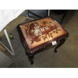 A small coffee table with picture of owls in top signed G Cundill.