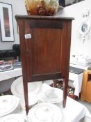 A mahogany pot cupboard.