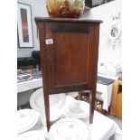 A mahogany pot cupboard.