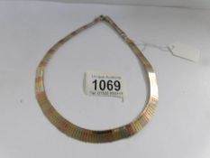 A 9ct tri coloured gold necklace.
